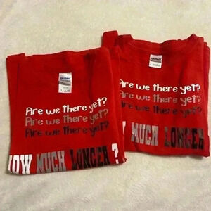 2 Boys T shirts in red ARE WE THERE YET HOW MUCH LONGER sizes Medium & Large.